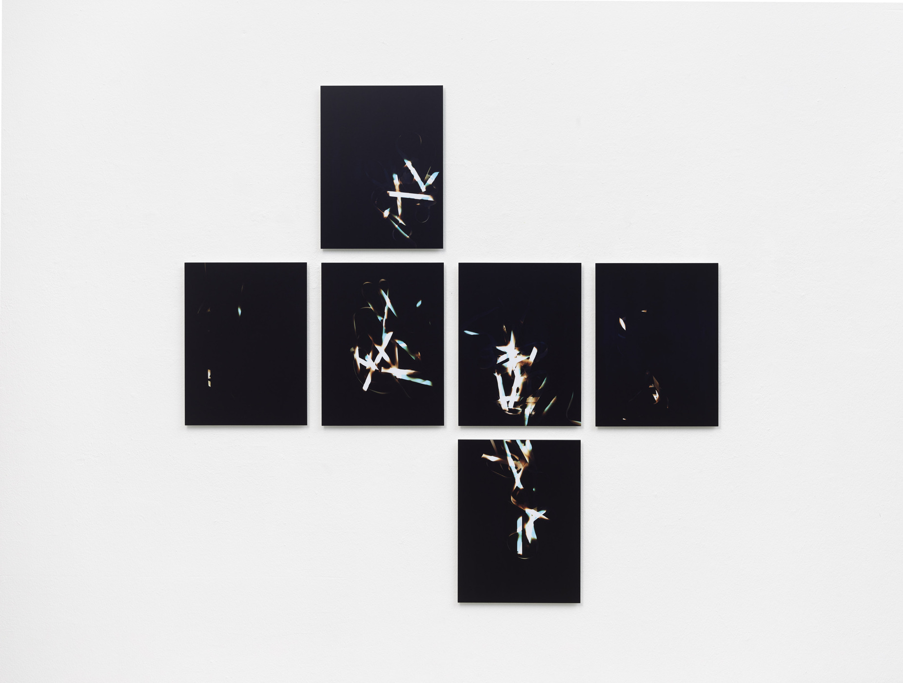 Installation view of abstract photographic series by Vanessa Enríquez.