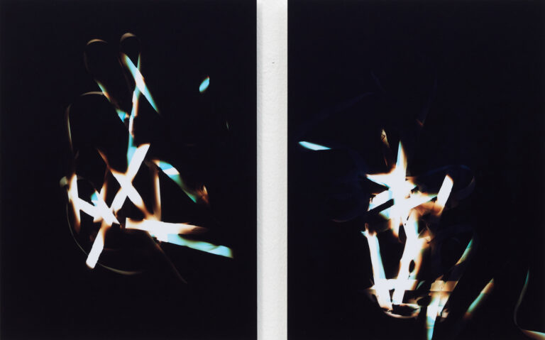 Abstract light-based photographic artwork by Vanessa Enríquez on black background.