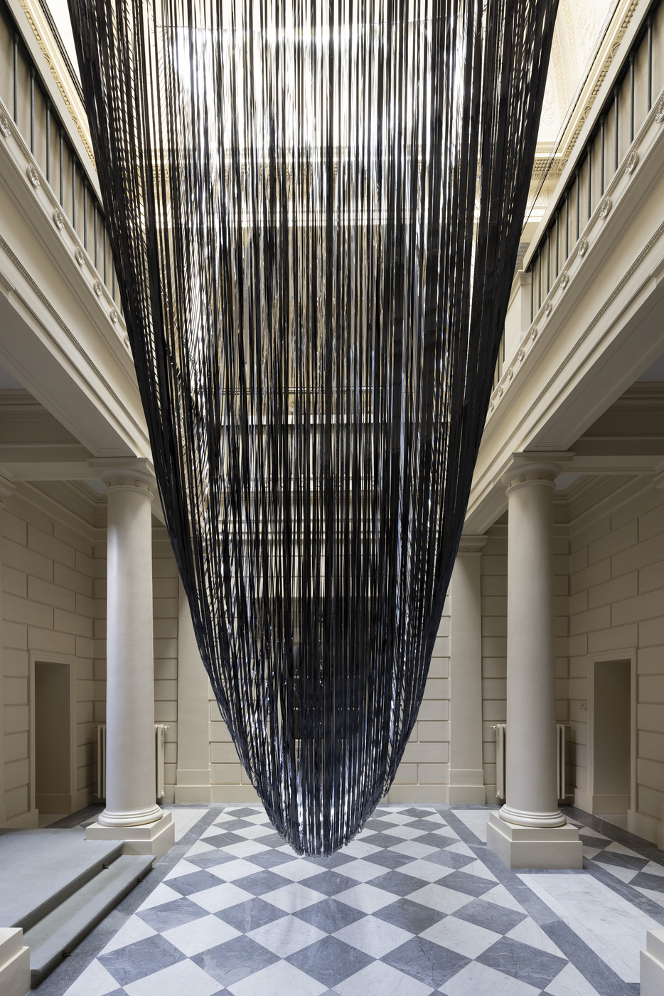 Vanessa Enríquez - Fluctuations Nigredo-Rubedo, spatial drawing with VHS magnetic tape